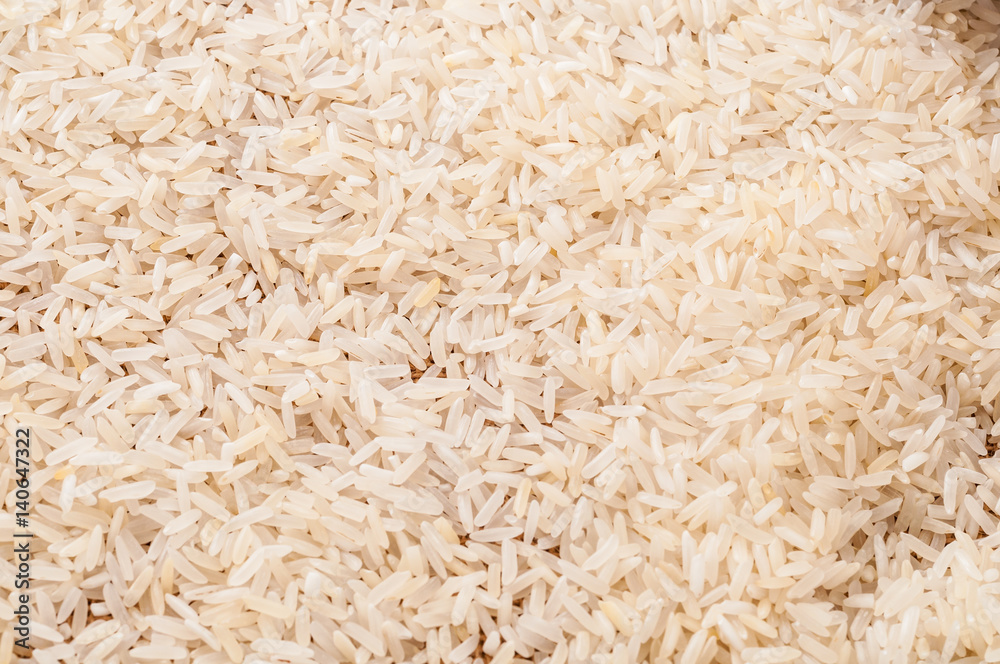 Top view to raw white Jasmine rice background Top view to raw white Jasmine rice background