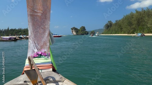 Long tail boat left port nopparat thara beach heading to poda island ,Krabi Thailand. photo