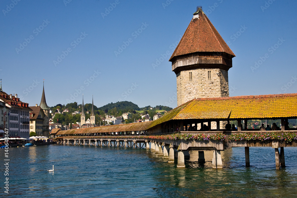 Old bridge over river in Lucerne, Switzerland.