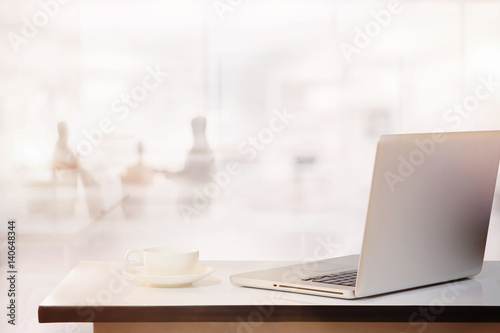 office desk with laptop and business office background. © bongkarn