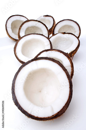 Studio shot of halved coconuts