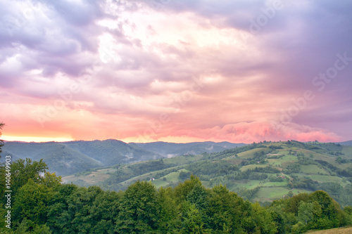 Majestic sunset in the mountains landscape. Overcast sky before storm. Carpathian, Romania, Europe. Beauty world.