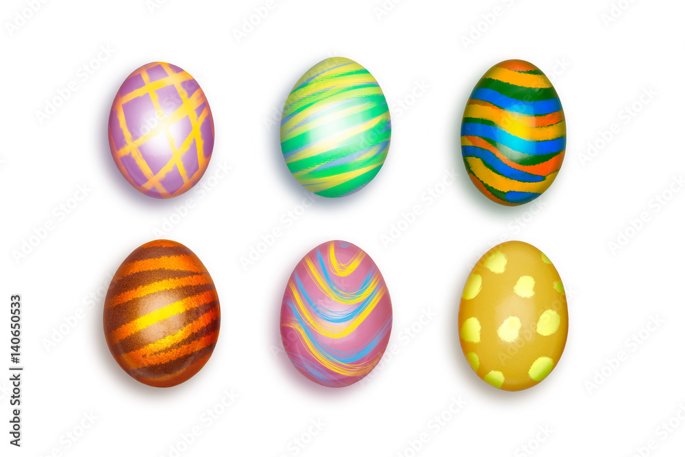 Looking down, vertical view of Small colorful decorated Easter eggs isolated on a white background.