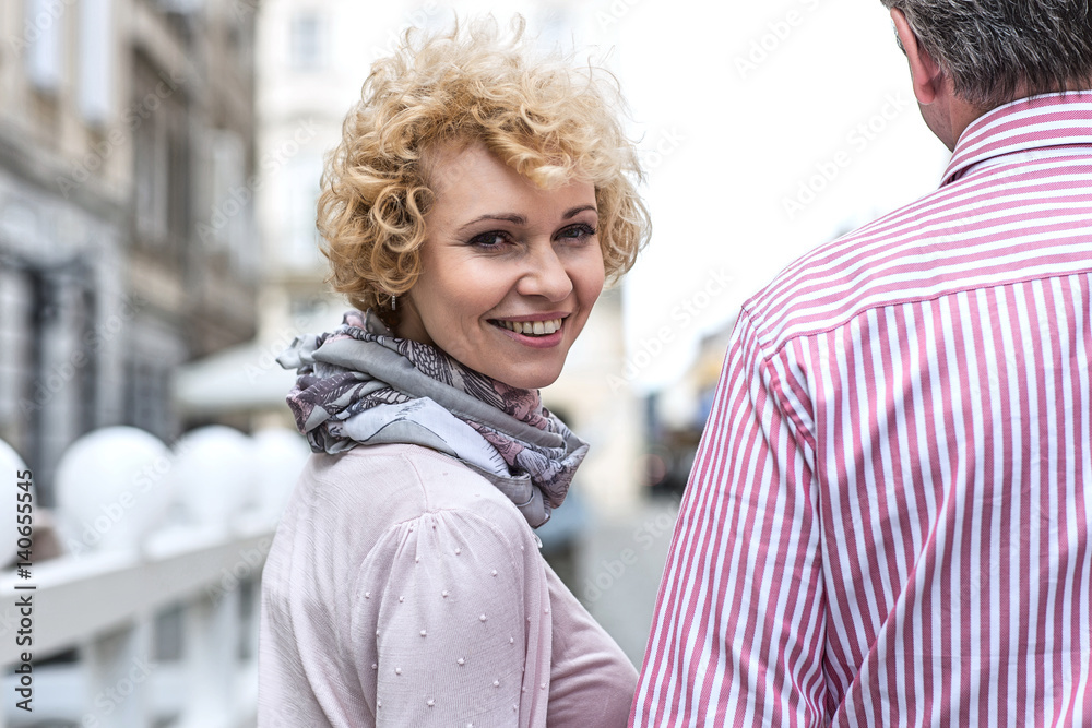 Fototapeta premium Portrait of happy middle-aged woman with man outdoors