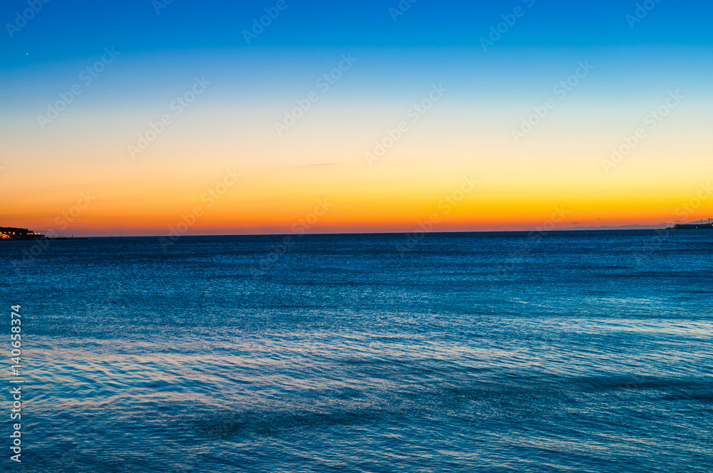 Tranquil sea landscape at sunset