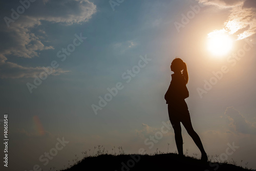 Silhouette Woman Stand Looking At The Sky