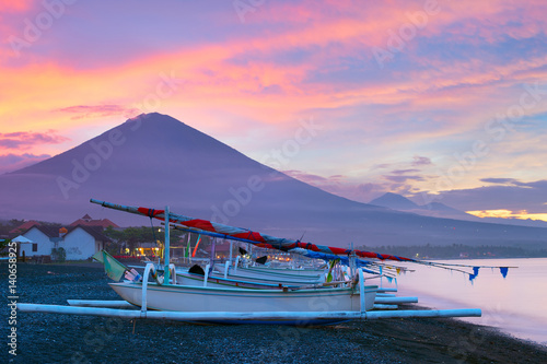 Volcano, ocean, fishing boats. Bali photo