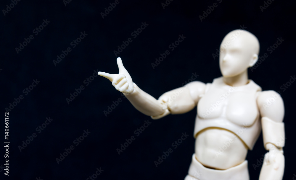 Plastic Model lifting arm on black background.. Plastic Model lifting arm on black background..