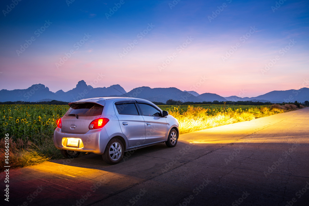 Travel car with sunset and landscape view.