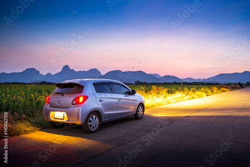 Travel car with sunset and landscape view.