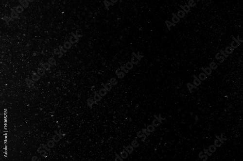 Abstract background of spray water drops on black background
