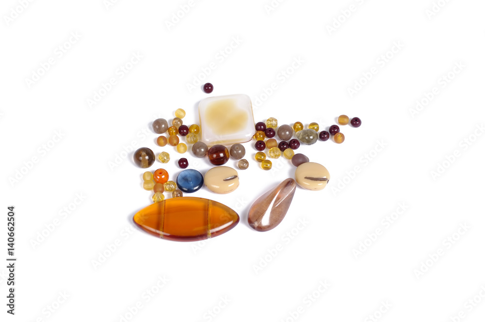 Pressed multicolored glass beads on white background - isolated