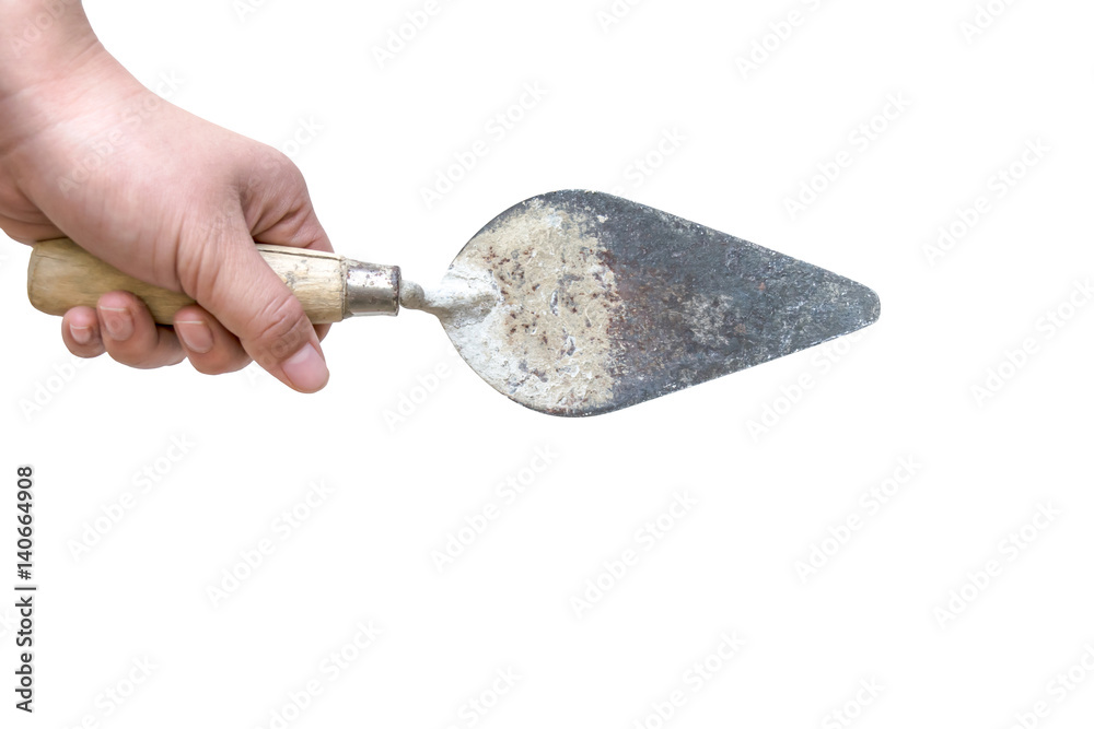 hand holding old trowel isolated on white background with clipping path