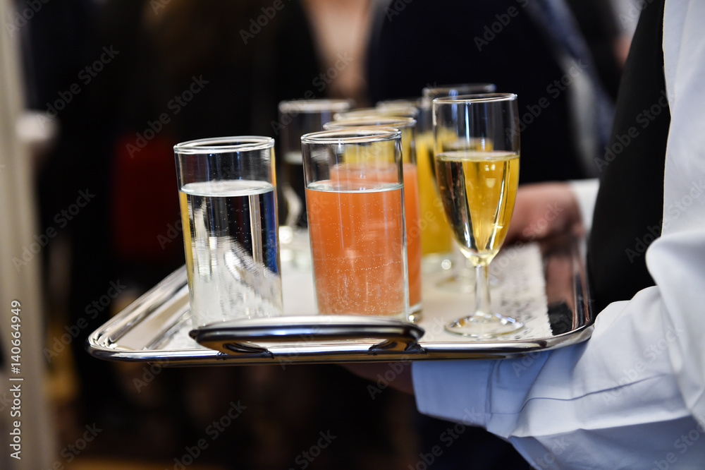 Waiter holding a tray with beverages during cocktail party