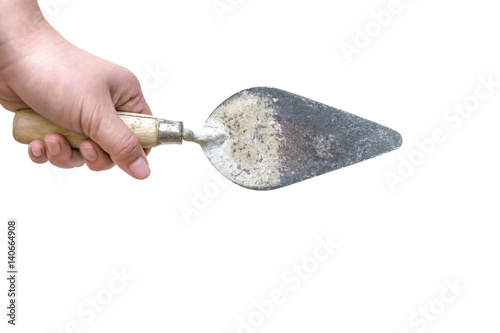 hand holding old trowel isolated on white background with clipping path