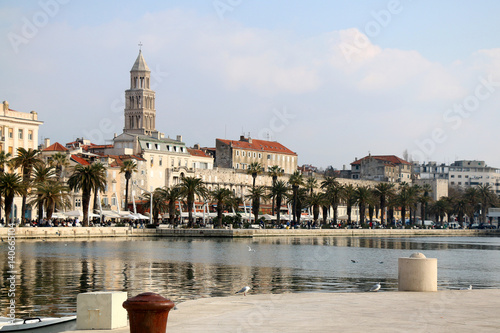 Waterfront in Split, Croatia. Seagulls on Matejuska cove with The Riva promenade and Saint Domnius bell tower in the background. Landmarks in Split.