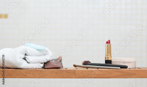 Make-up and Spa Objects, on a little wooden shelf, Lipstick, Towel and Manicure Set and Brushes