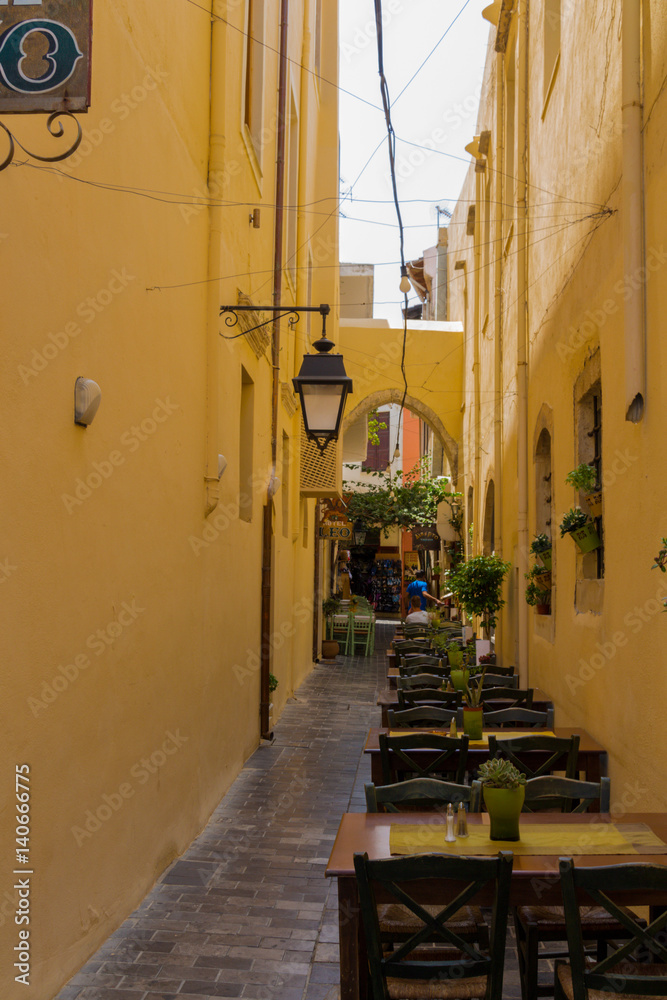 Rethymno, Greece - August  3, 2016: Narrow venetian street in old town.