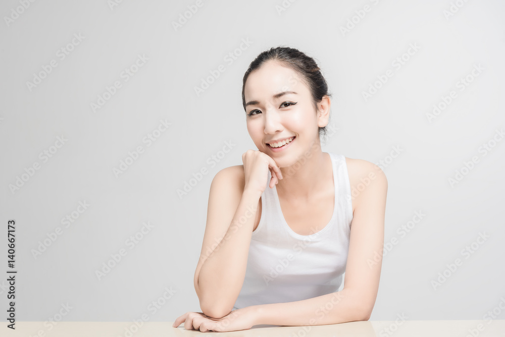 Asian woman with beautiful skinface non make up,pure cosmetic isolated on white background Asian woman with beautiful skinface non make up,pure cosmetic isolated on white background