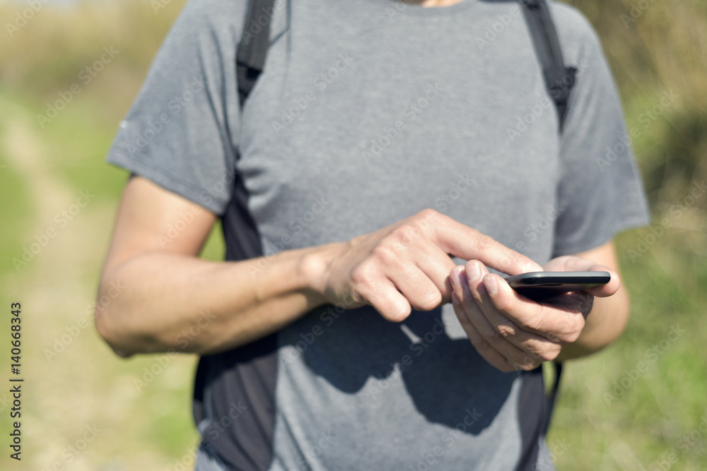 young man using a smartphone outdoors