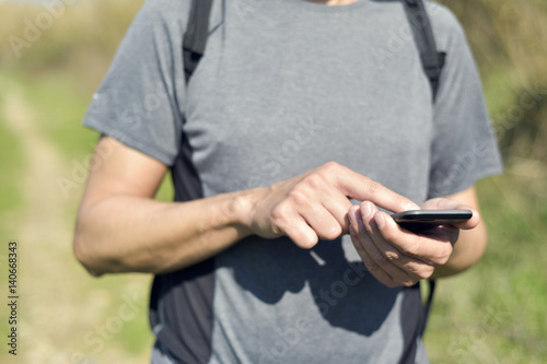 young man using a smartphone outdoors