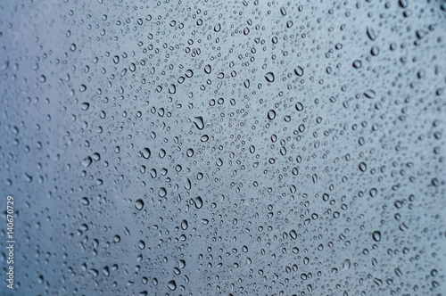 Close up to water drops on glass with selective focus