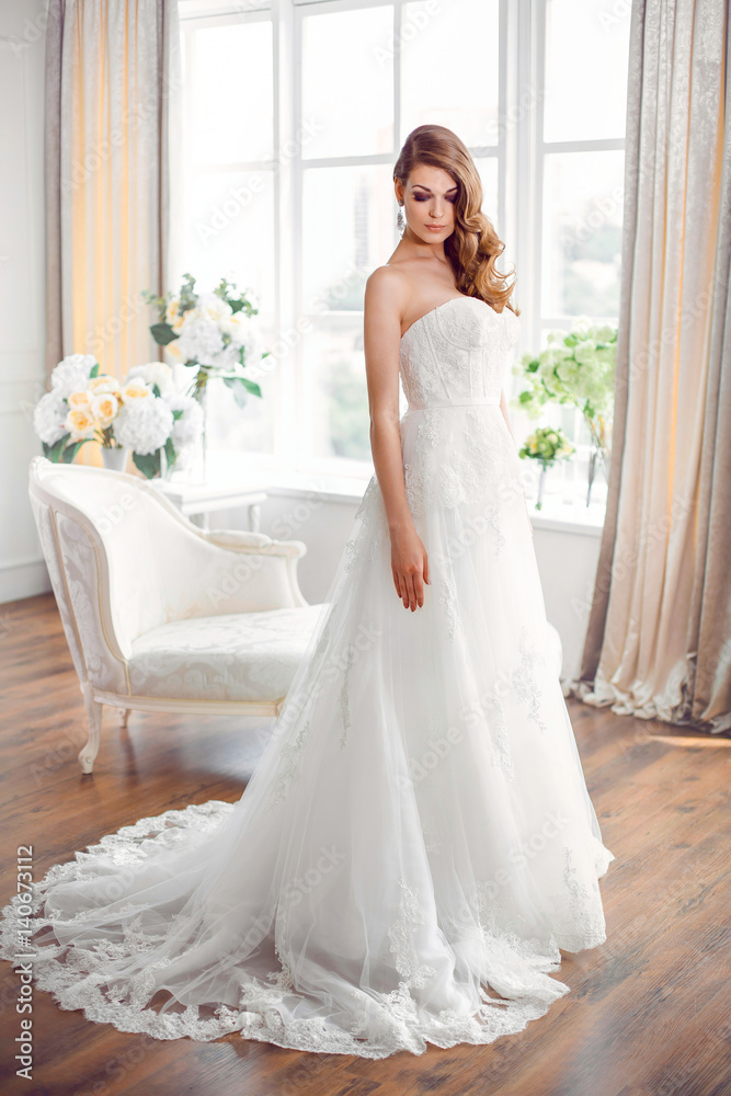 Bride in gorgeous wedding dress indoors. Wedding fashion Bride in gorgeous wedding dress indoors. Wedding fashion
