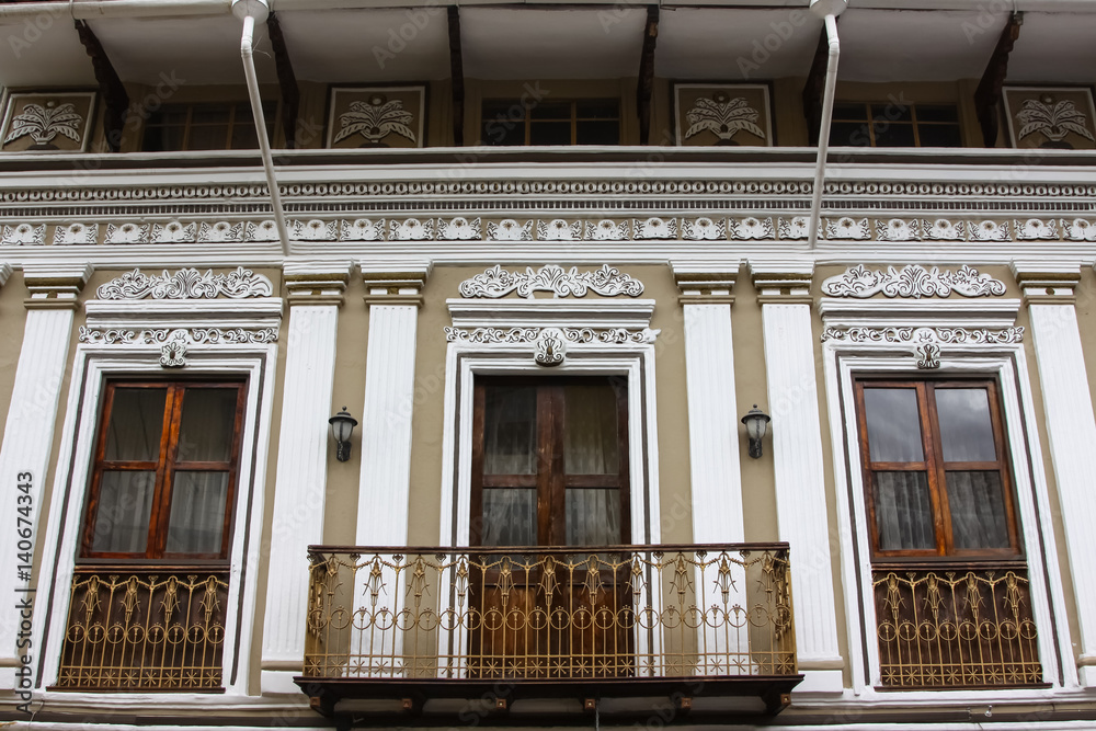 Obraz premium Low angle view to a window front of an colonial building in Cuenca, Ecuador
