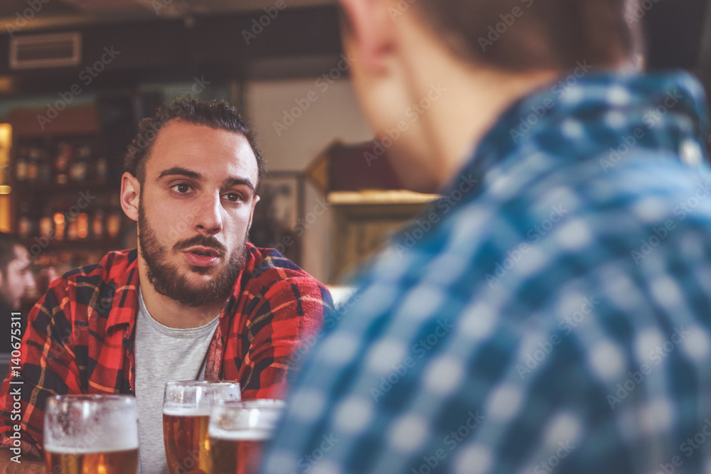 Group Of Hipster Friends Drinking Craft Beer focus on Hipster