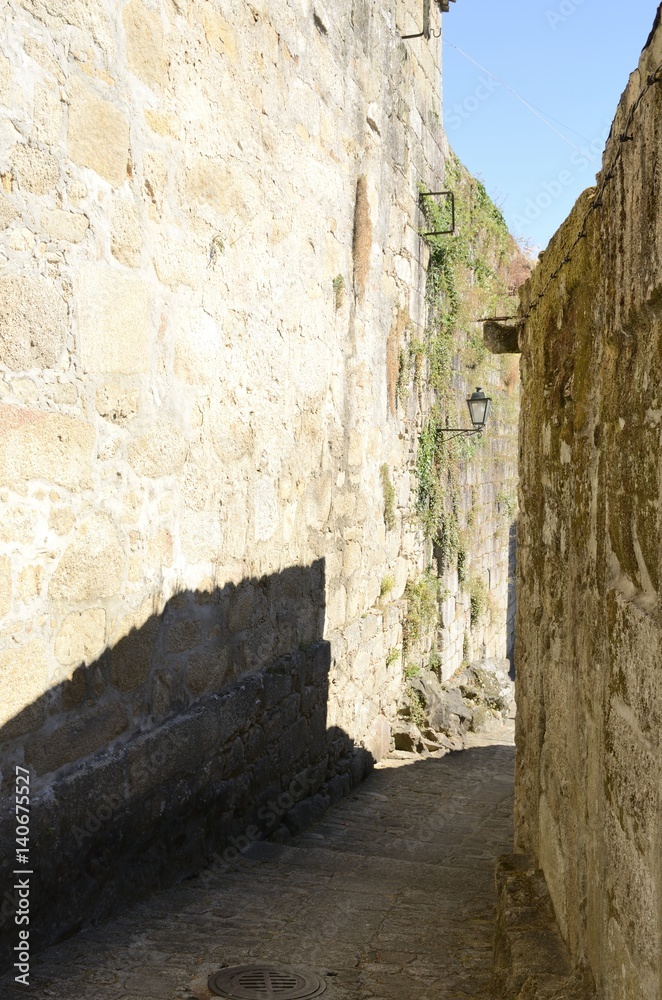 Narow stone alley in Tui, Galicia, Spain