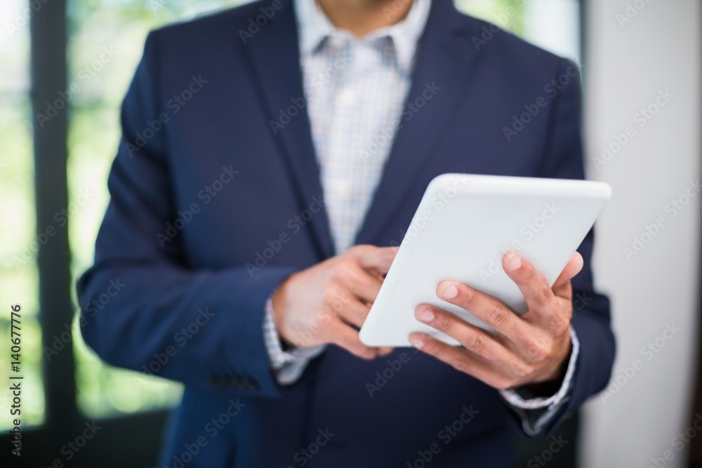 Businessman using digital tablet in a restaurant Businessman using digital tablet in a restaurant