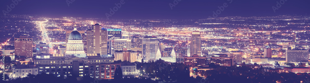Vintage toned Salt Lake City downtown night panorama, Utah, USA. 