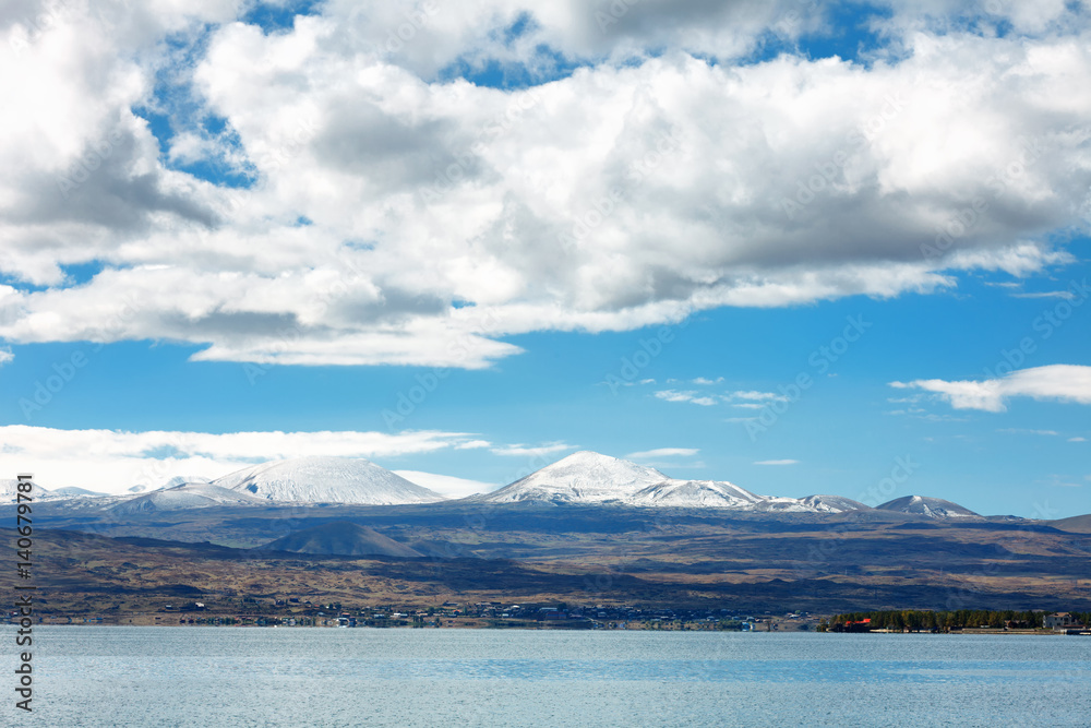 Sevan lake and white clouds blue sky on a sunny day, Armenia
