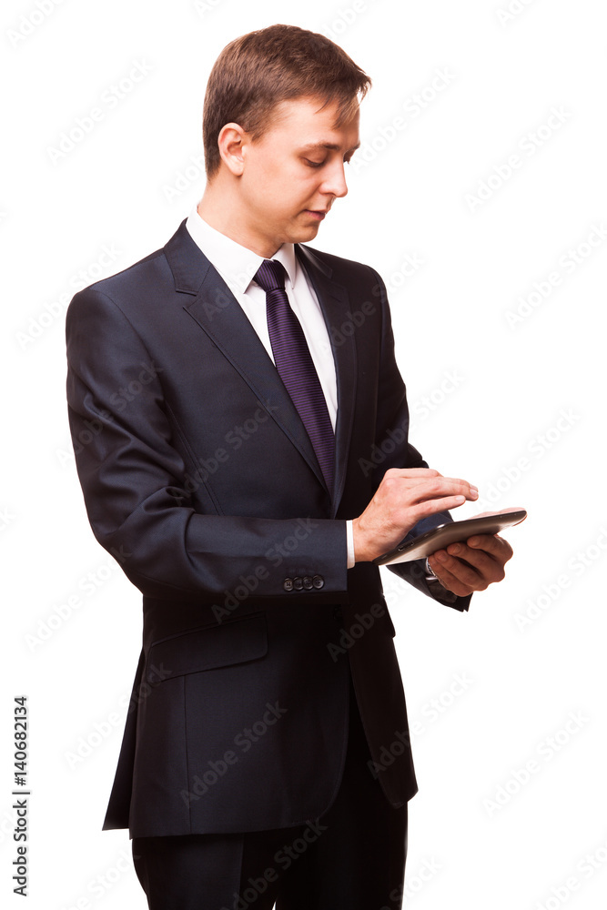 Young handsome businessman is working on his digital tablet isolated on white background Young handsome businessman is working on his digital tablet isolated on white background