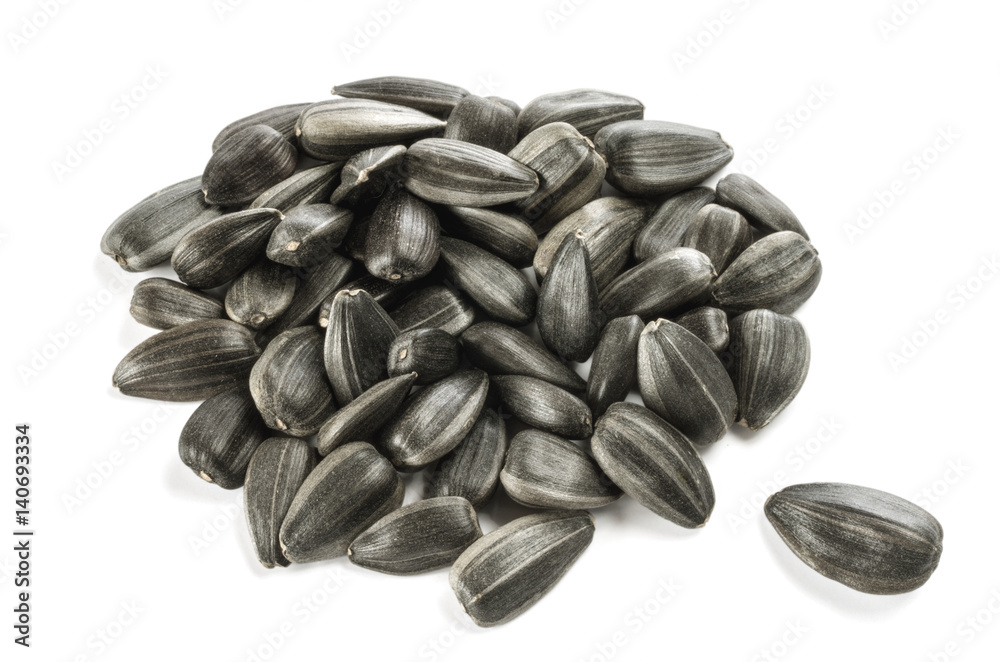 Heap of sunflower seeds isolated on the white background. Heap of sunflower seeds isolated on the white background.