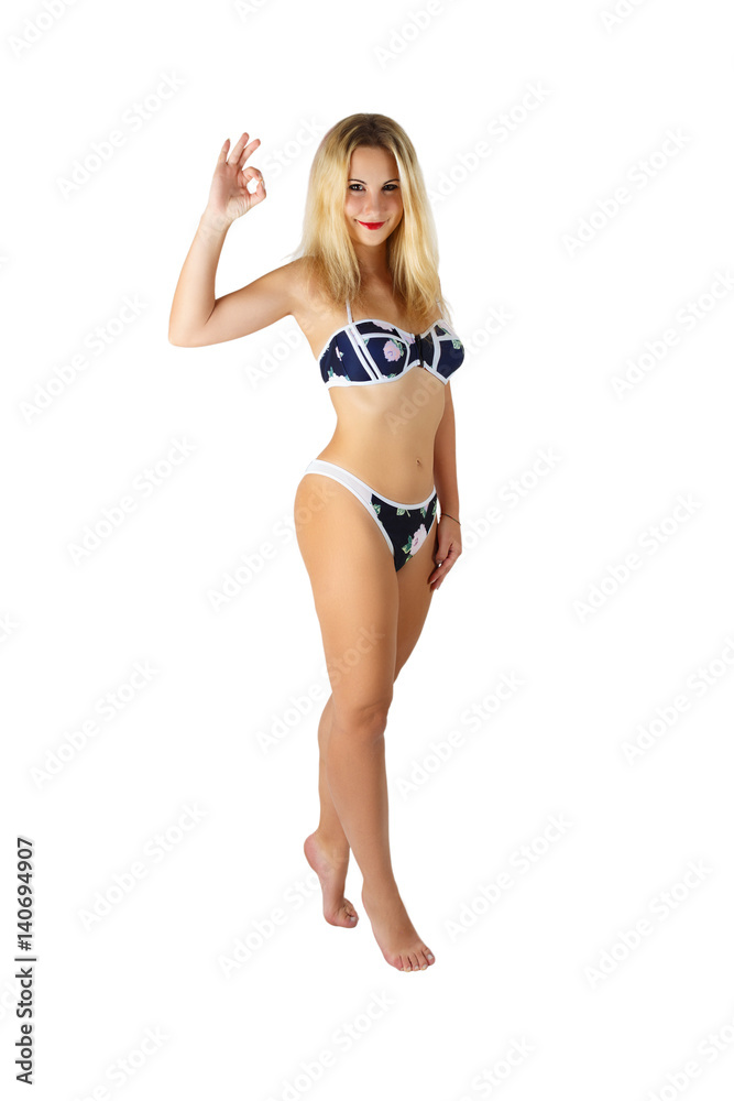 beautiful smiling girl in bikini with OK sign on white background beautiful smiling girl in bikini with OK sign on white background