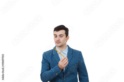 Young businessman man thinking about oportunities while holding a pencil in his hand.Idea Concept isolated on white background. photo