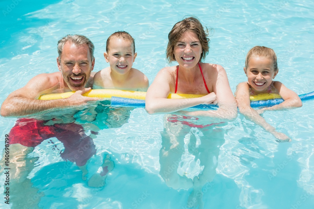 Fototapeta premium Happy parents and kids in pool
