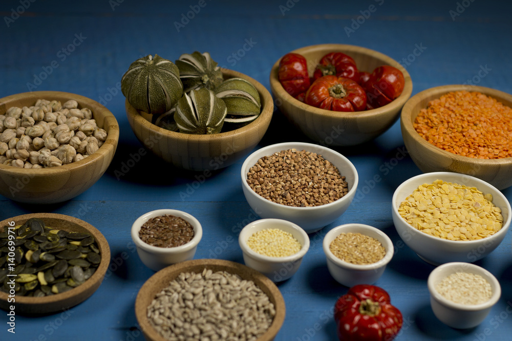 Various dried legumes in bowls for background, Raw legume on old rustic wooden table, Healthy protein food,