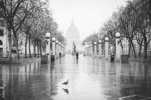 Photography Woman walking in the rain in San Francisco.