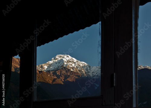 View of Annapurna through the window of the lodge in Chomrong - Nepal, Hima photo