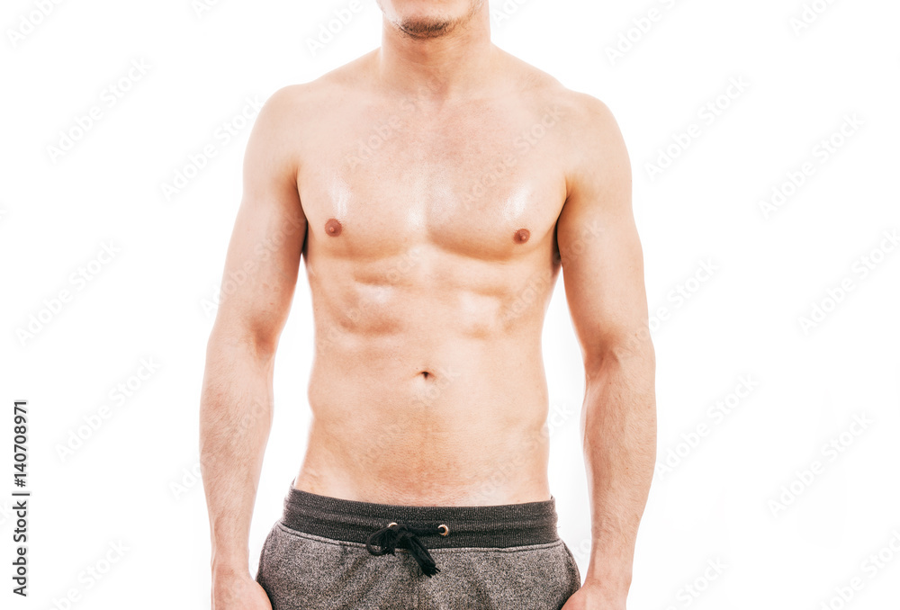 Muscular young man isolated on white background.