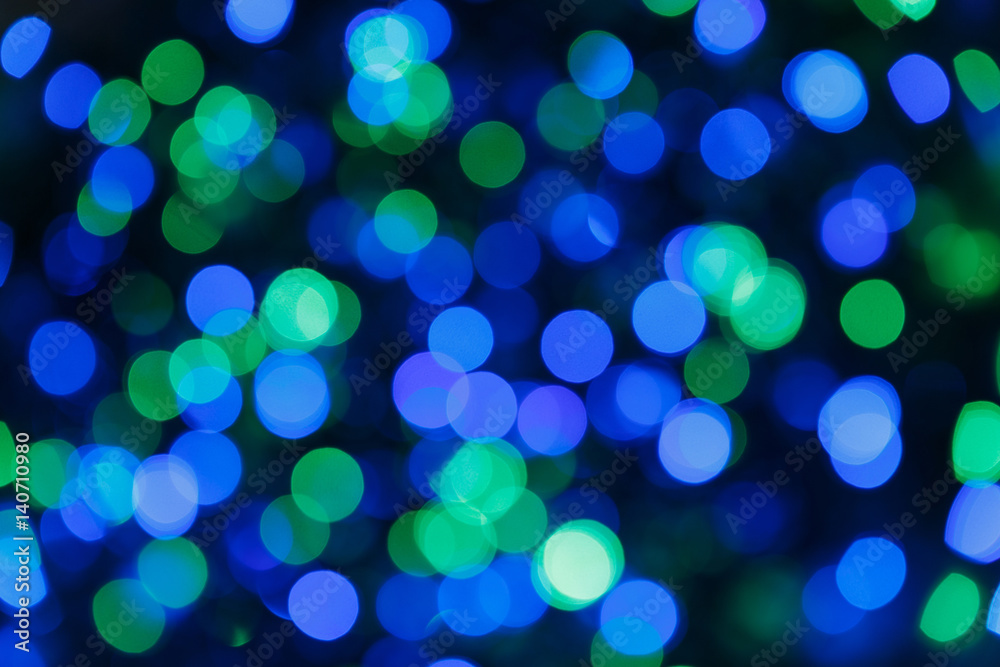 Blurred lights blue background. Glittering christmas effect. Abstract colorful pattern. Shimmering blur spots. Festive design. Blurred lights blue background. Glittering christmas effect. Abstract colorful pattern. Shimmering blur spots. Festive design.