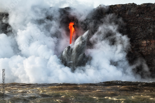 Close up of lava entry into ocean at Hawaii. photo