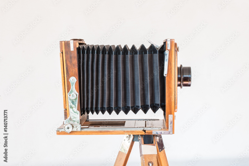 Old vintage big camera made of wood and metal on white background close-up  side view Stock Photo | Adobe Stock
