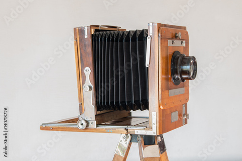Old vintage big studio camera made of wood and metal on white background close up