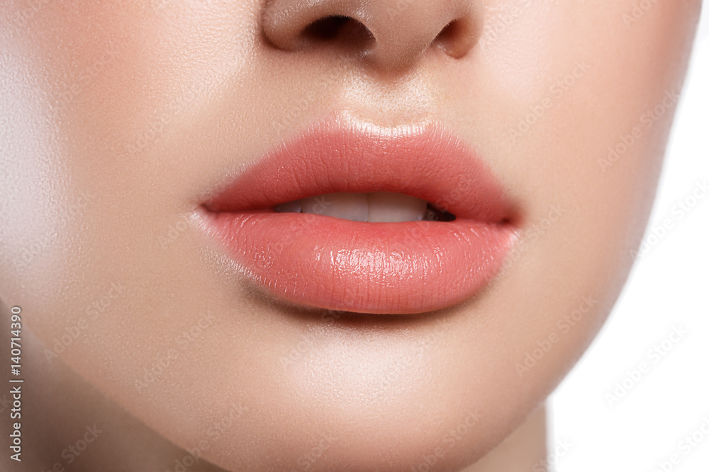 Perfect natural lip makeup. Close up macro photo with beautiful female mouth. Plump full lips. Perfect natural lip makeup. Close up macro photo with beautiful female mouth. Plump full lips.