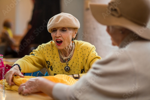 Surprised woman and clothes. Stylish senior female. Age and vogue.