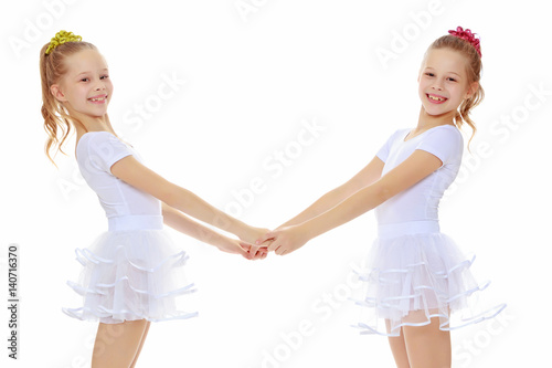Cute girls holding hands