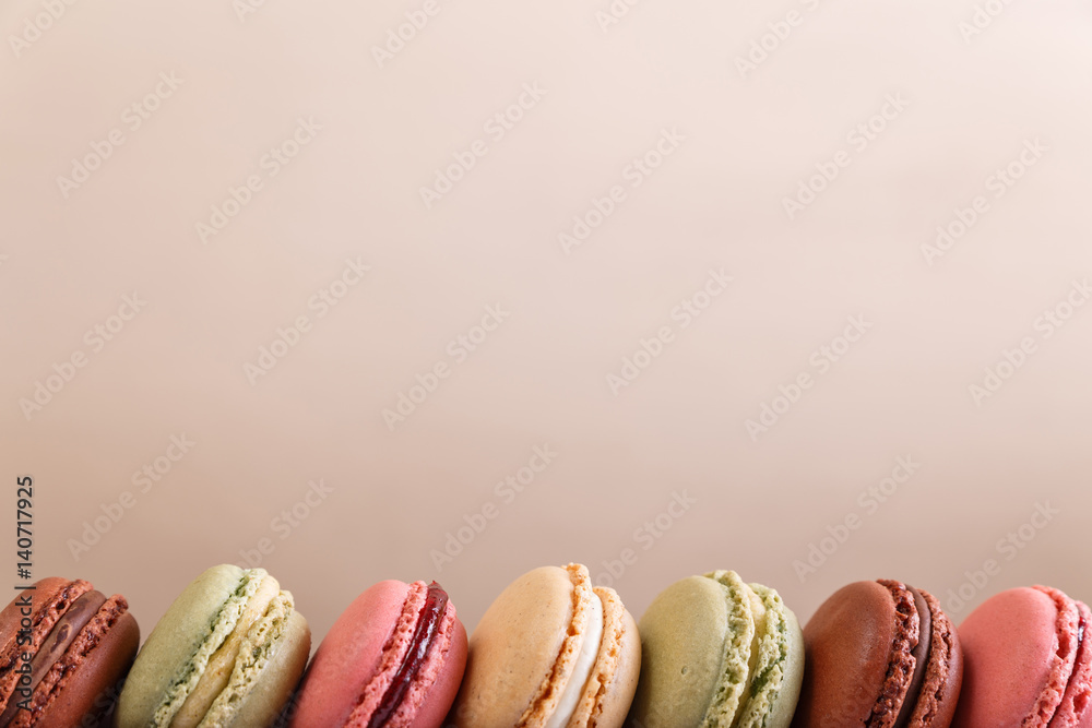 Fototapeta premium Macaroon cakes. Different types of macaron. Colorful almond cookies. French sweet dessert.